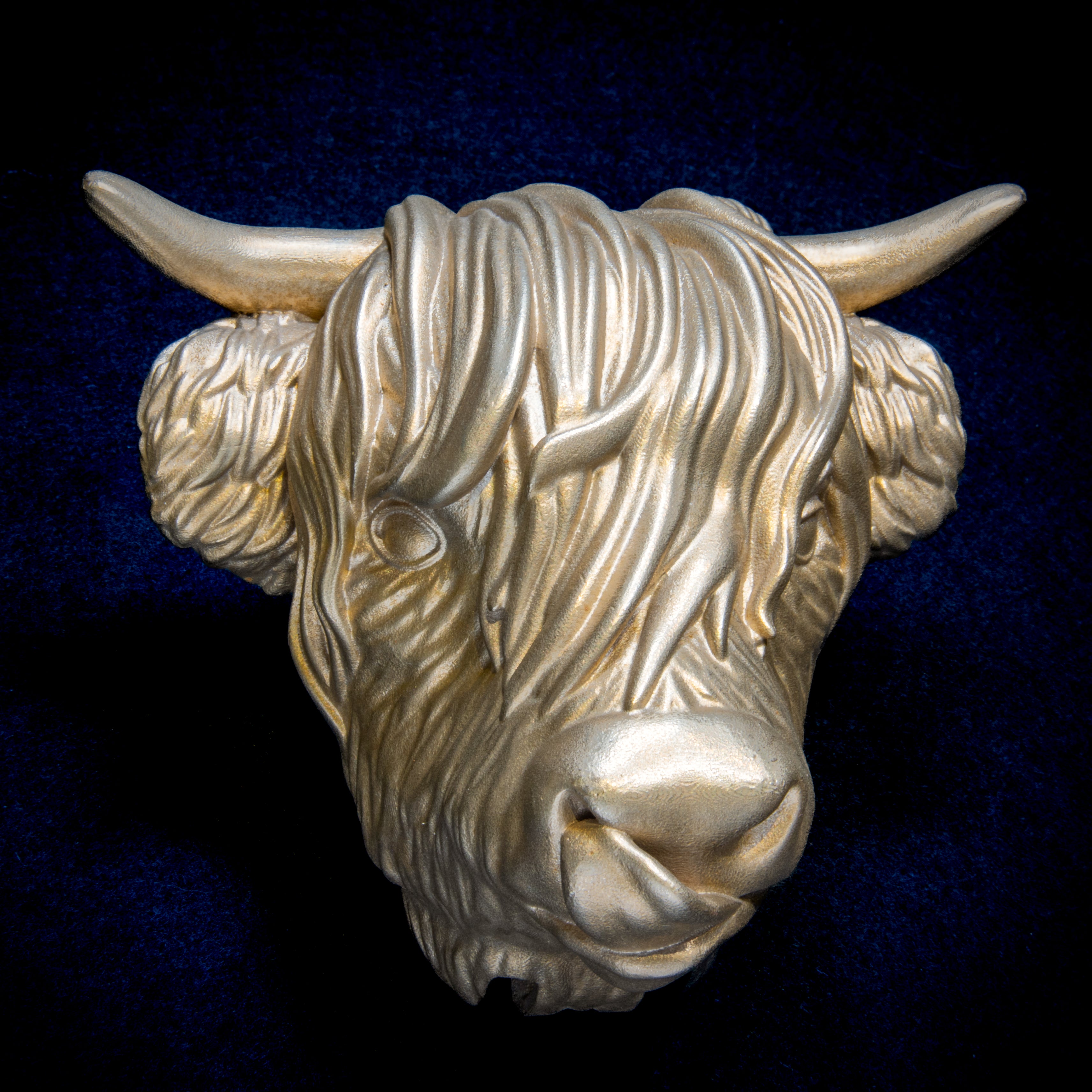 Farm Animals collection: Highland Cow Tongue Out door knocker head on navy cloth, horns wide, tongue curled up to one nostril