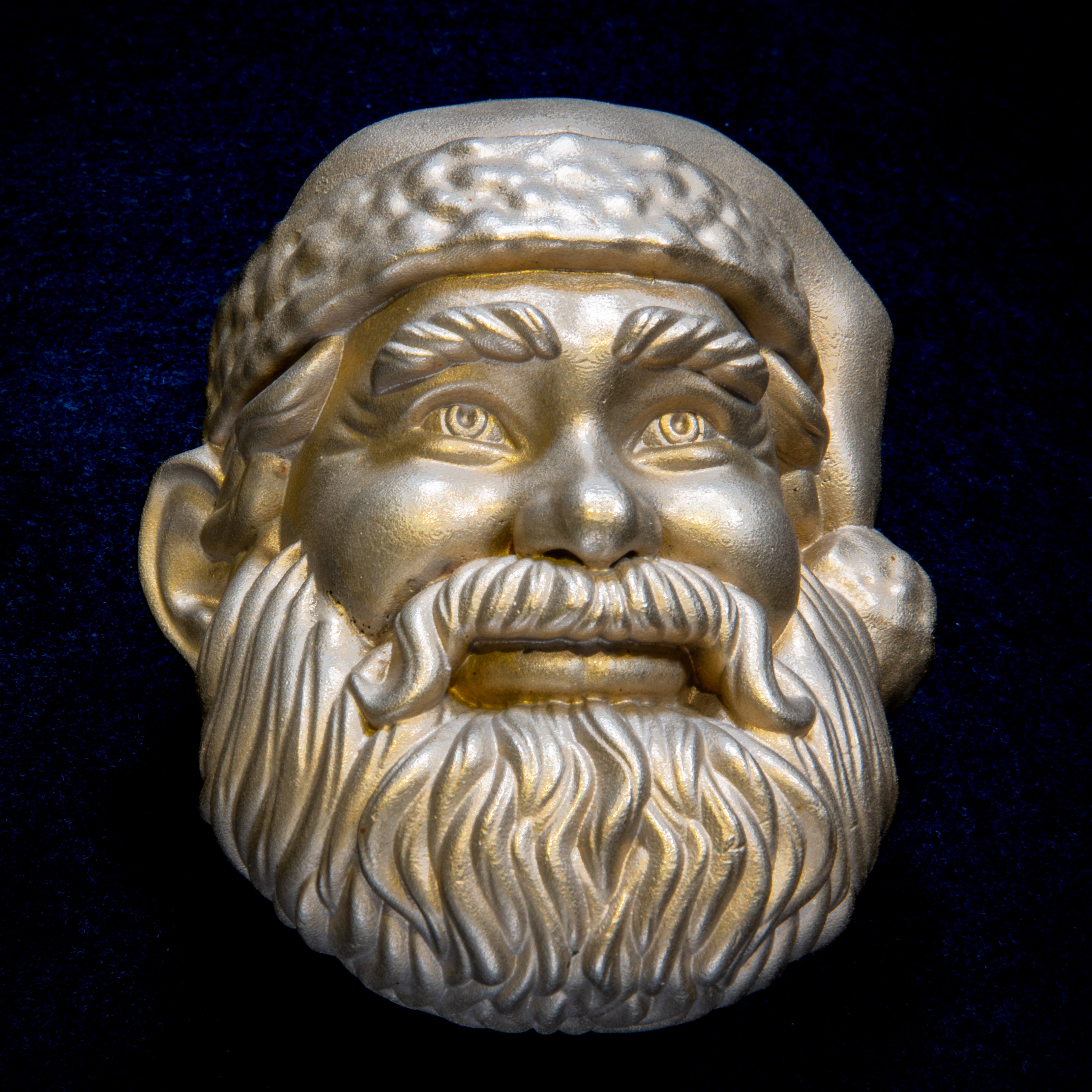 Christmas collection: Santa door knocker head on navy cloth, fur-trimmed hat, curled moustache and a full wavy beard