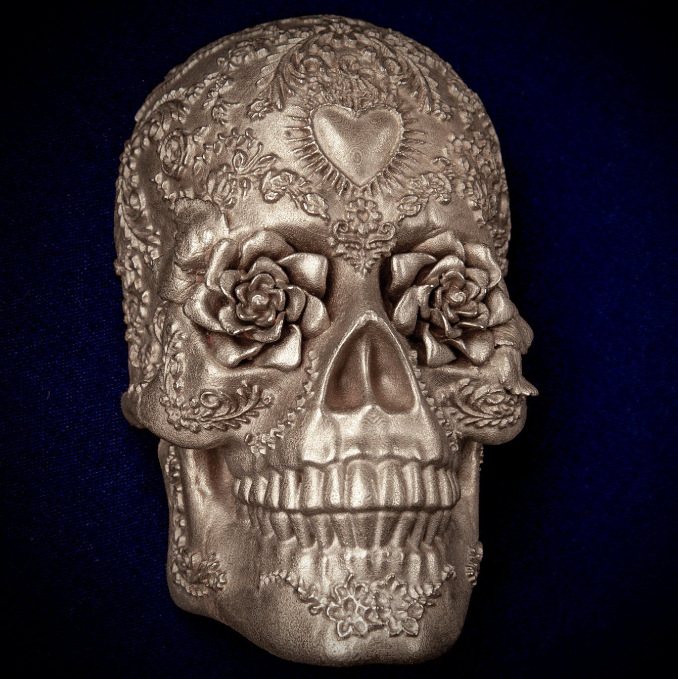 Día de los Muertos collection: Radiant Rose Sugar Skull door knocker head, roses in the eye sockets, a rayed heart on the brow