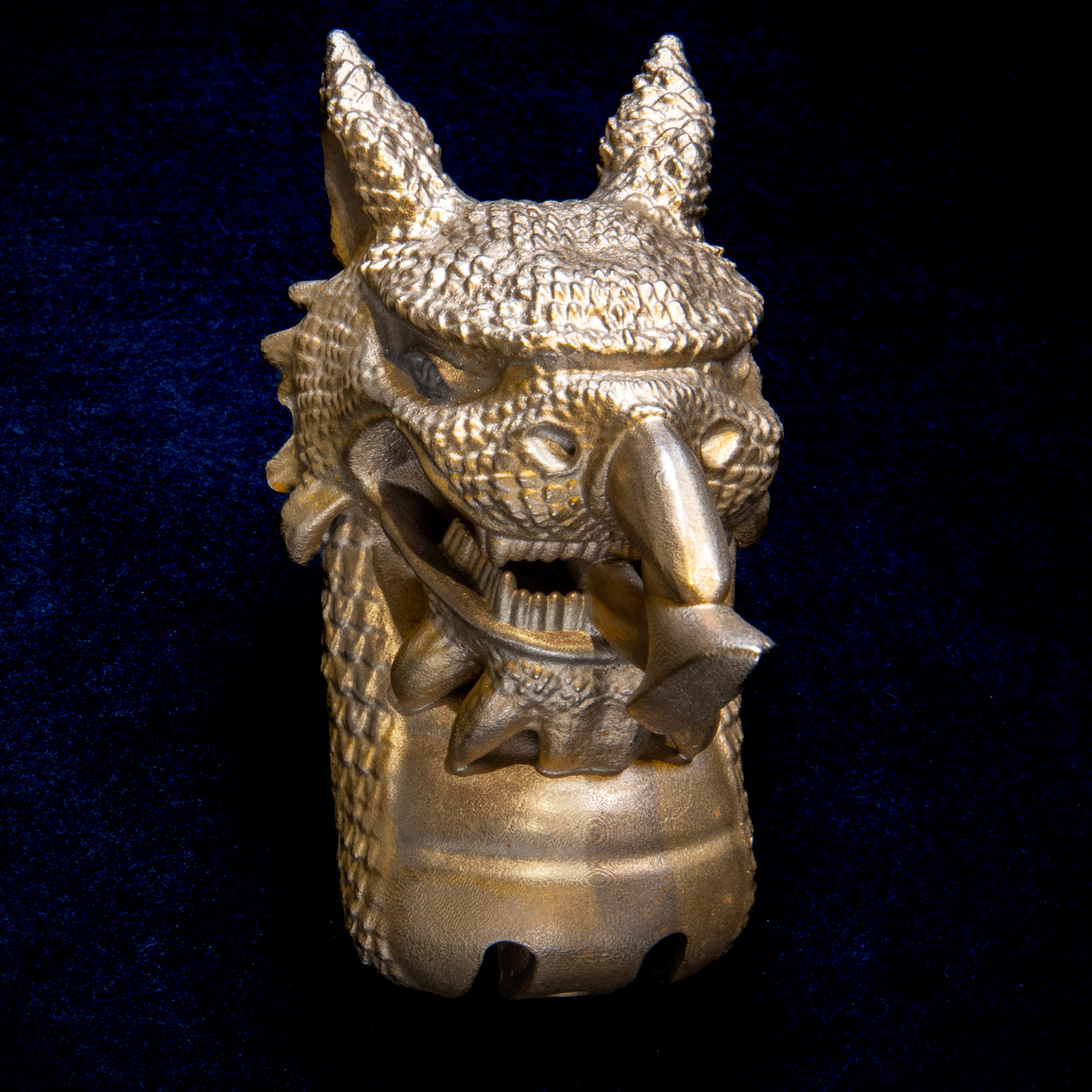 National Animals collection: Welsh Dragon door knocker head on navy cloth, pointed ears, open jaws and an arrow-tipped tongue