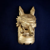 Welsh Dragon interchangeable door knocker head, front view on navy cloth, pointed ears, rows of teeth, arrow-tipped tongue