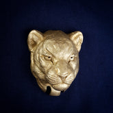 Panther interchangeable door knocker head, front view on navy cloth, narrowed eyes, whisker pads and a closed mouth