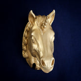 Magical Unicorn interchangeable door knocker head on navy cloth, three-quarter view, spiral horn, forelock and scrolled mane