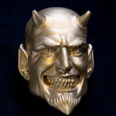 Devil interchangeable door knocker head on dark navy, front view, horns, pointed ears and a goatee below a wide grin