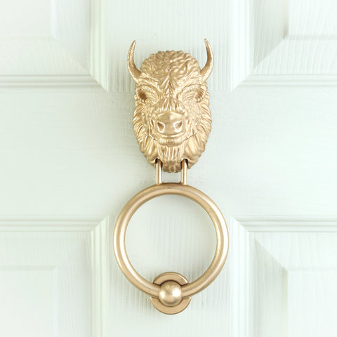 Bearded Bison brass door knocker on a pale front door