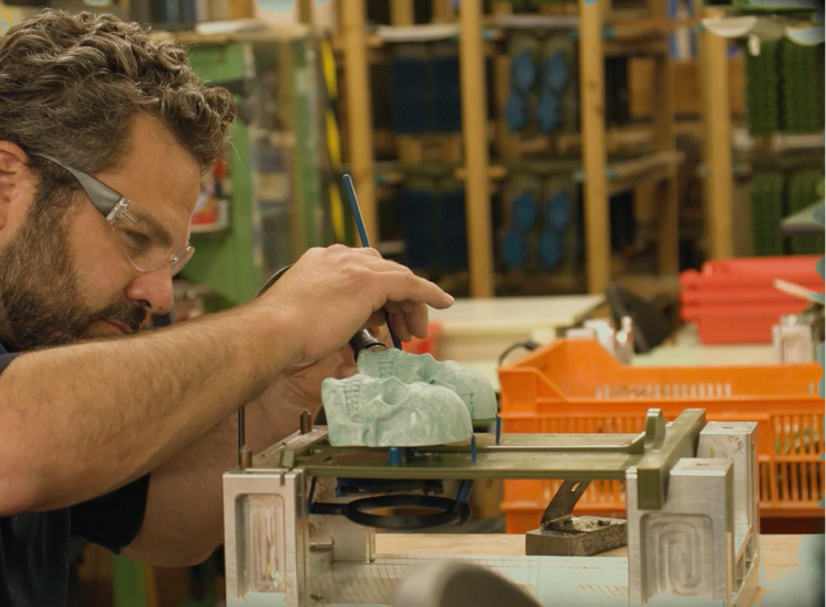Ben Shaw hand-finishing a wax model at the foundry, part of Yorkshire Foundry’s lost-wax brass casting process.