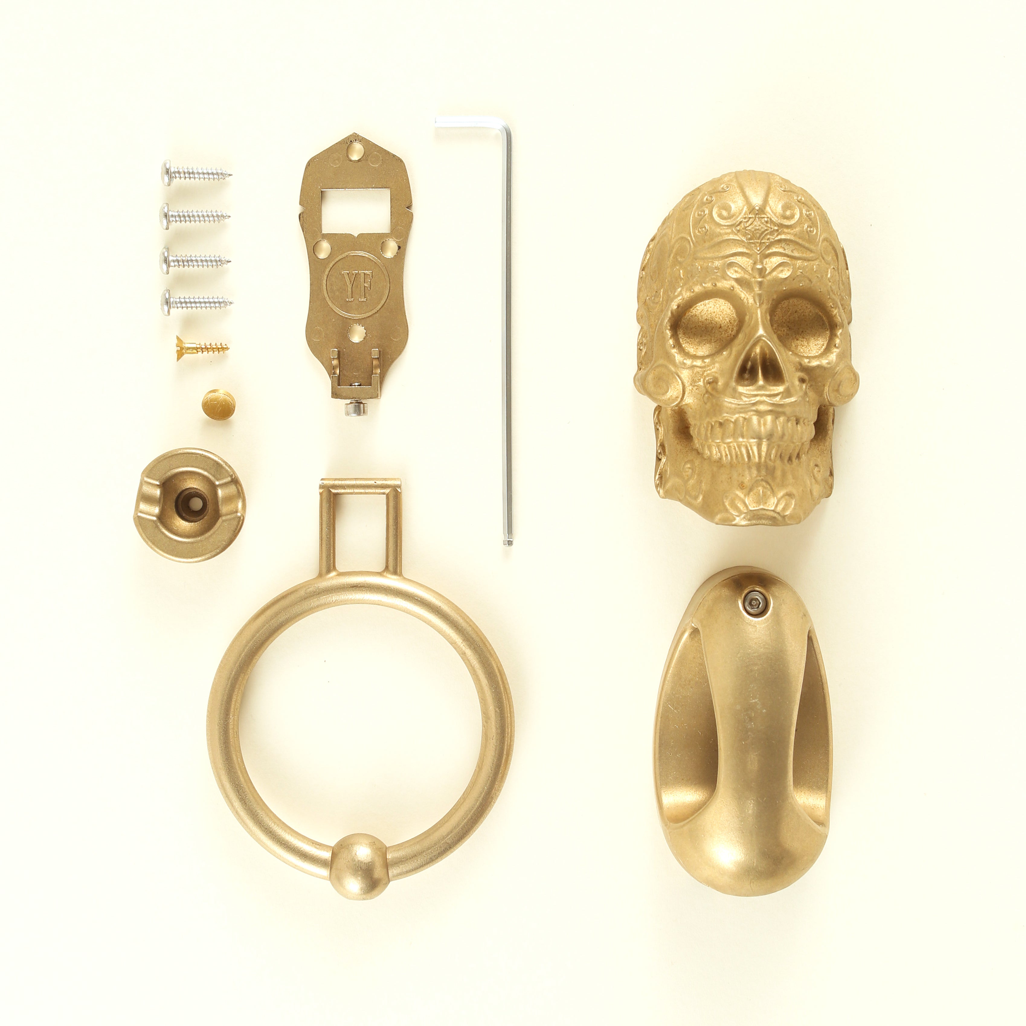 Delicate Scroll Sugar Skull door knocker parts: head seen front and back, backplate stamped YF, ring, strike plate and screws