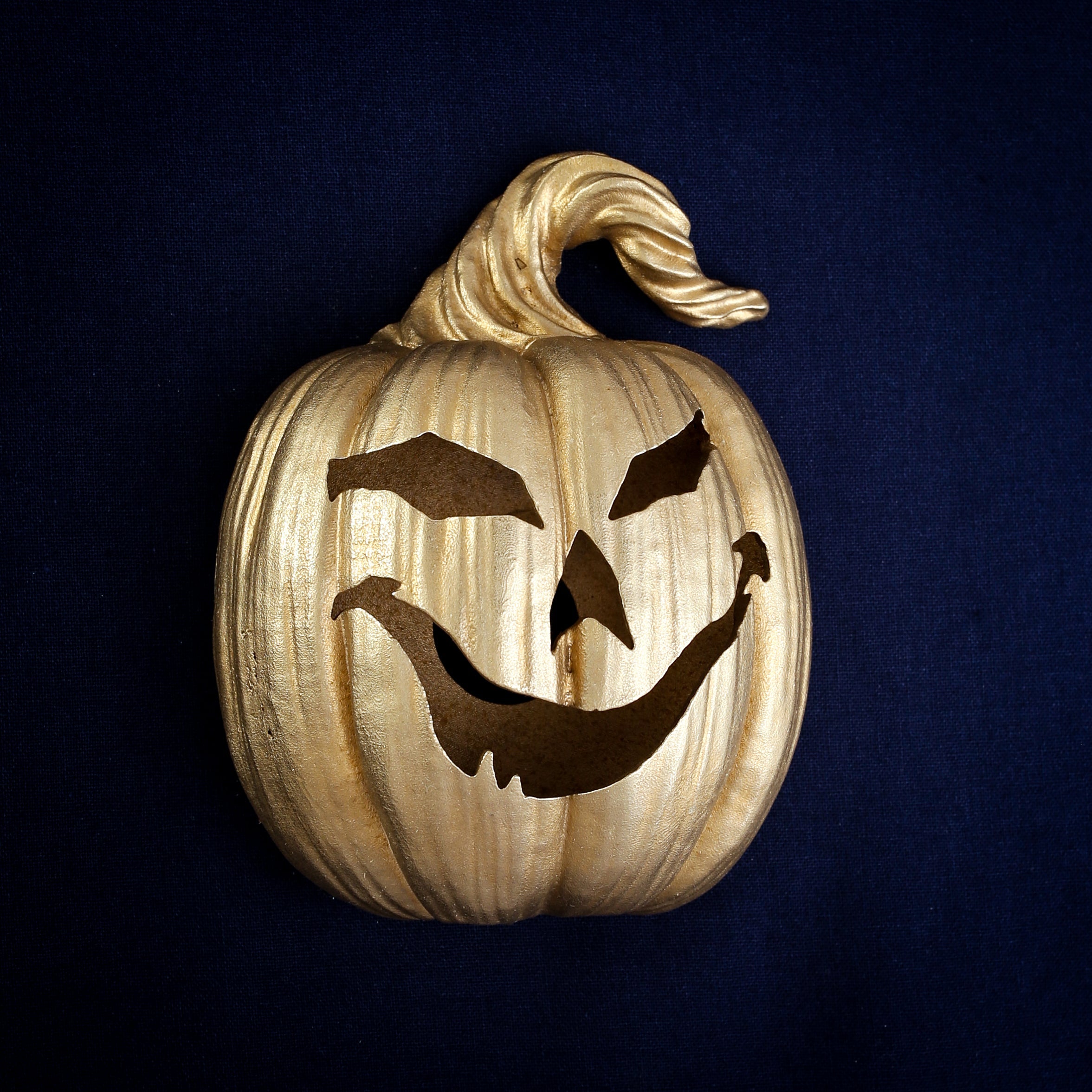 Laughing Jack-o'-Lantern interchangeable door knocker head, long curved grin with one fang, cast in Yorkshire