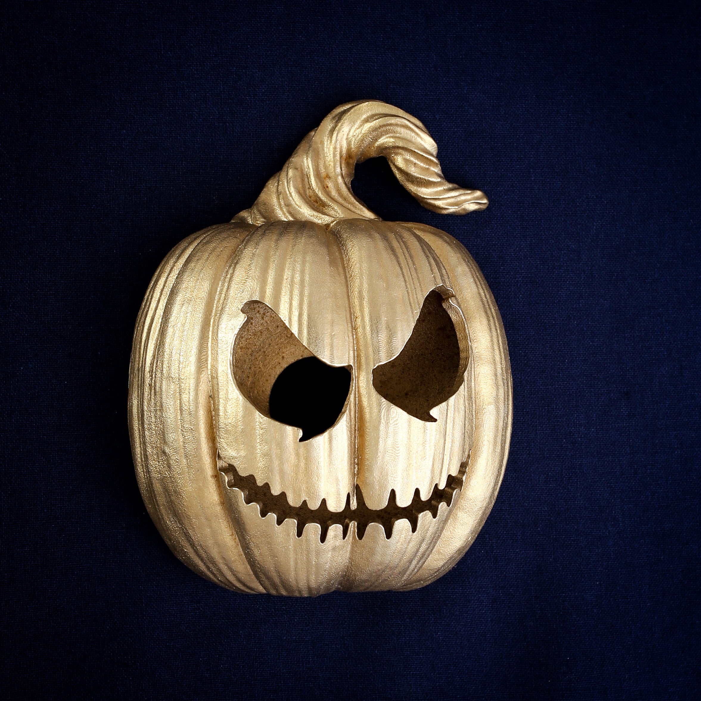 Grimacing Jack-o'-Lantern interchangeable door knocker head, clenched grin and scowling eyes, cast in Yorkshire