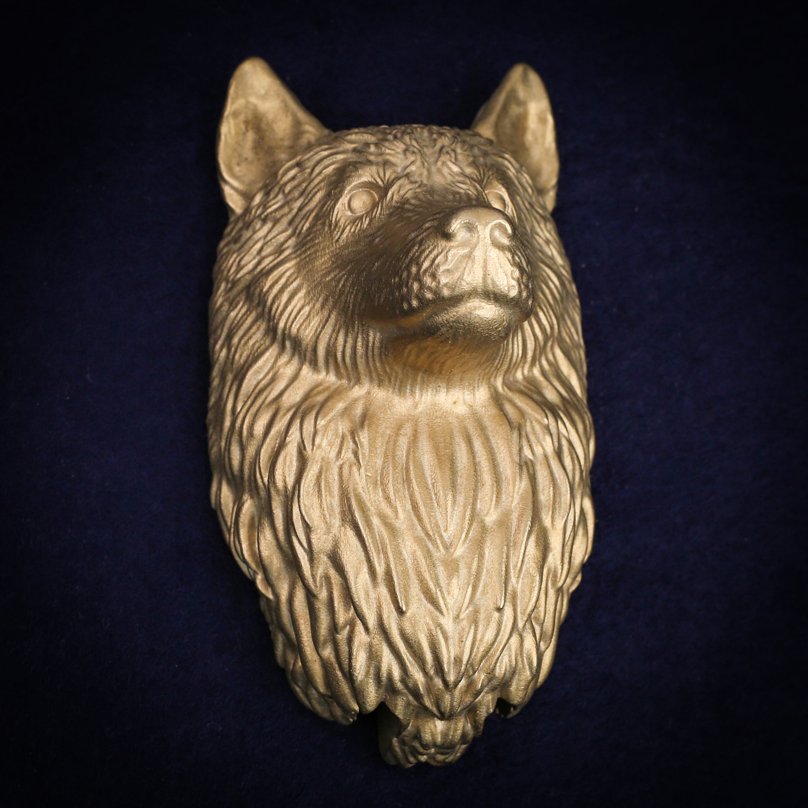 Husky interchangeable door knocker head on a blue background, showing the cast ruff detail