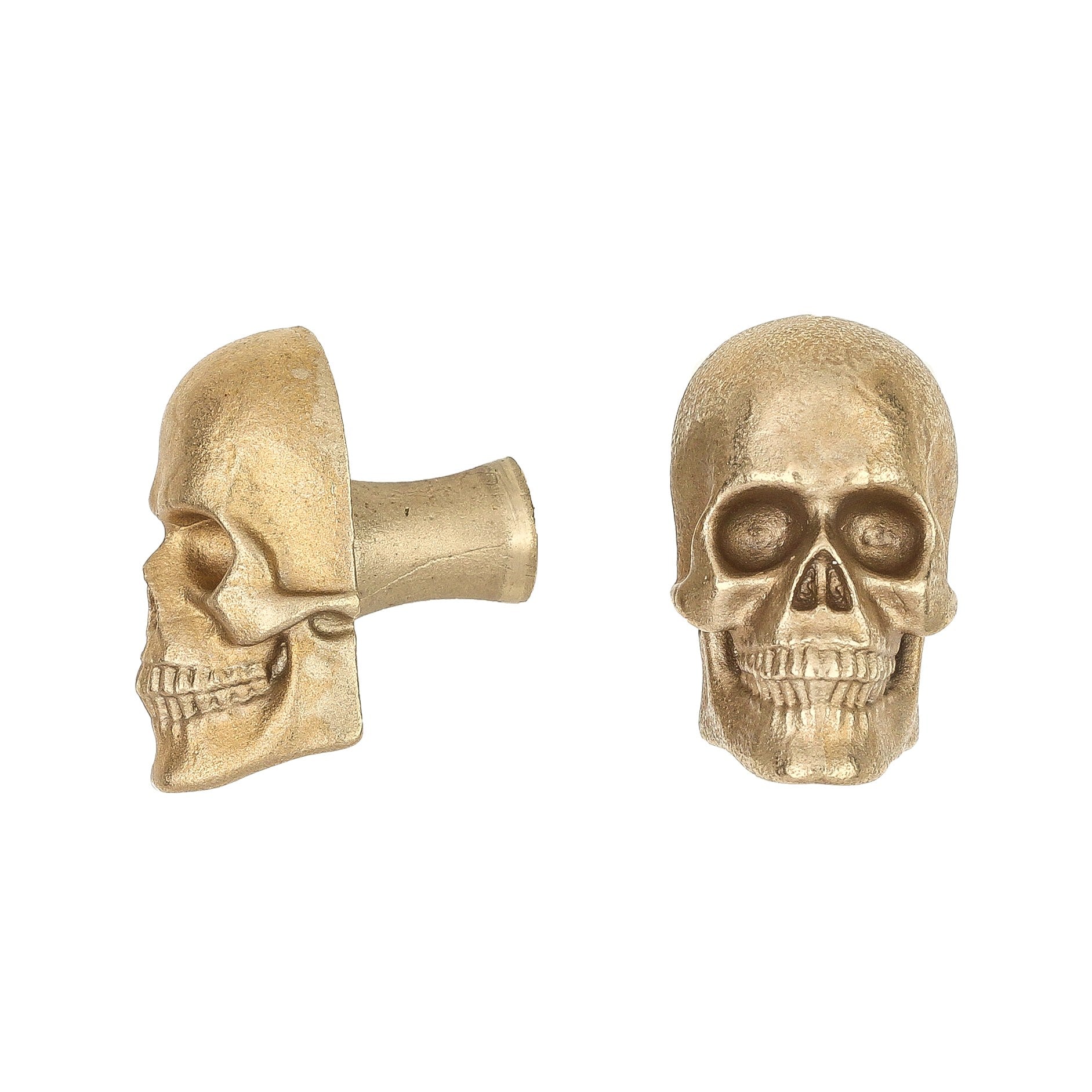 Skull brass cabinet knob and coat hook, cut out on white, one in profile showing the stem, one front on with open eye sockets