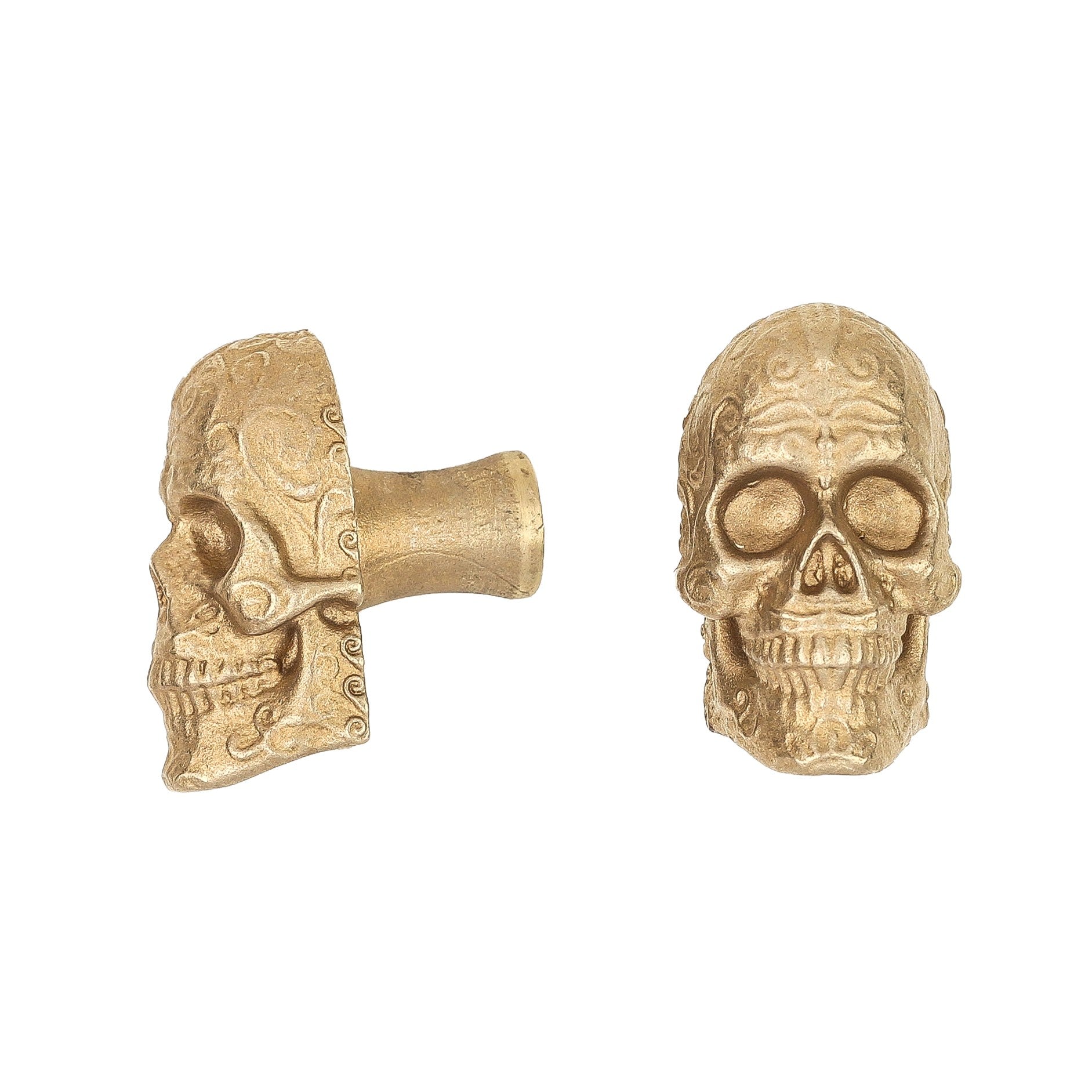 Sugar Skull brass cabinet knob and coat hook, cut out on white, one in profile showing the stem, one front on with scrollwork