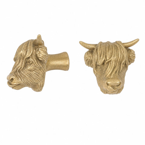 Highland Cow brass cabinet knob and coat hook with its tongue out, cut out on white, one in profile, one facing front